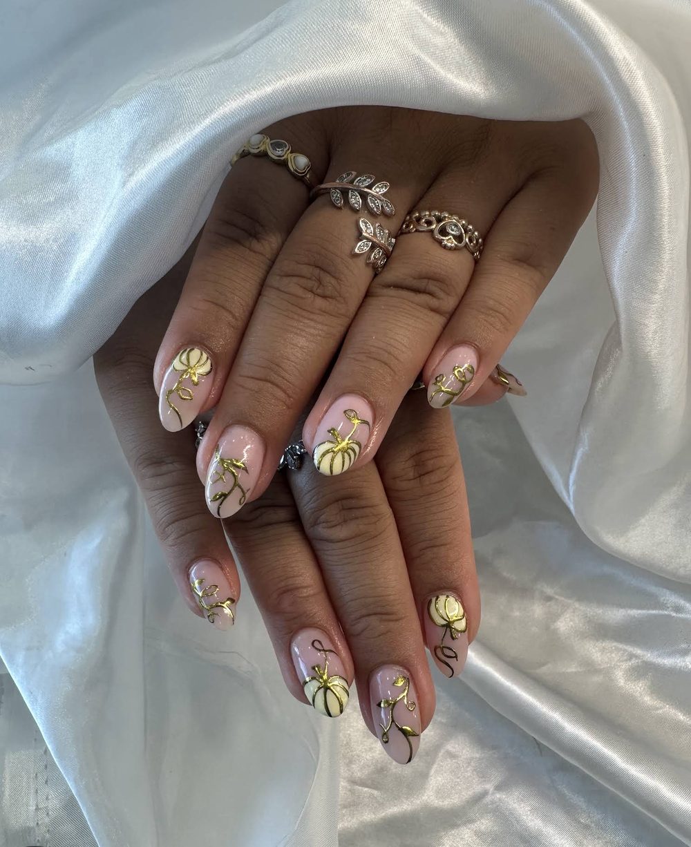 Gold floral nail art shared by a Pedi N Nails London guest