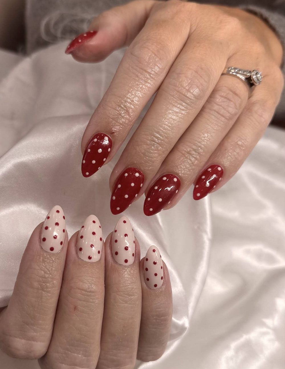 Red polka-dot nails shared by a Pedi N Nails London guest